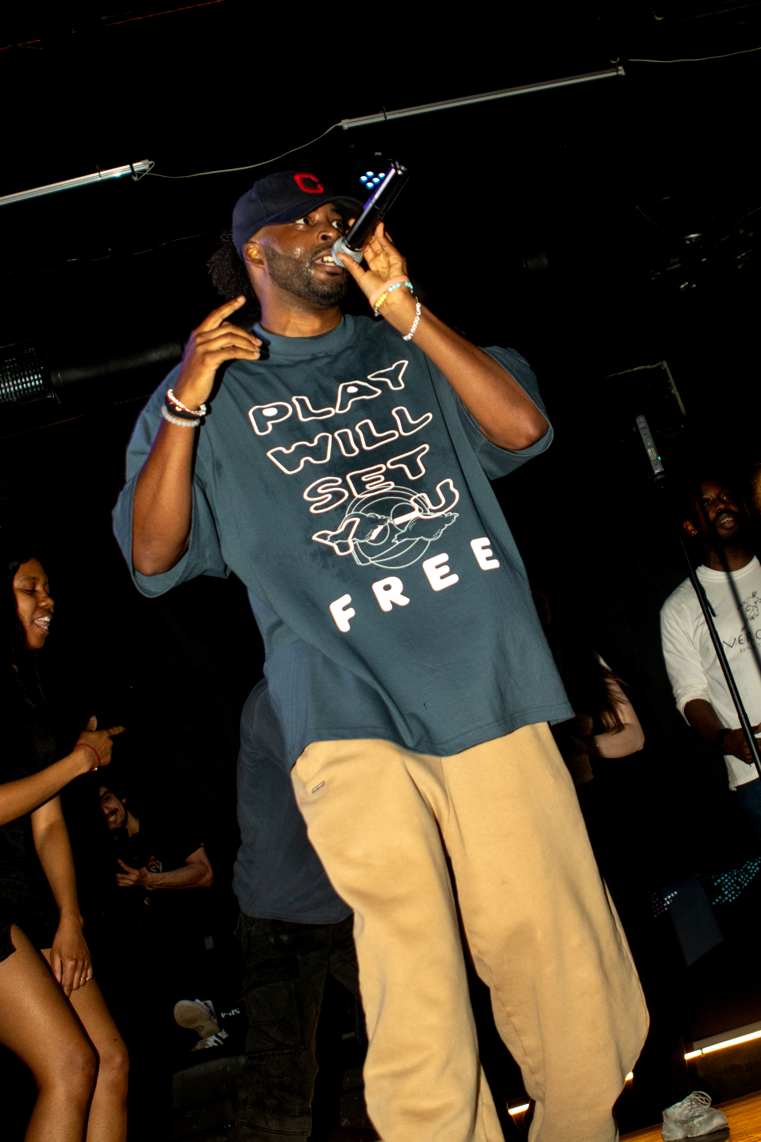 Ryan The Son performing in the PWSYF tee, crowd visible